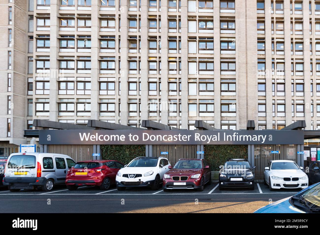 Doncaster Royal Infirmary main entrance, Doncaster, South Yorkshire, England, UK (number plates and faces obscured for privacy) Stock Photo