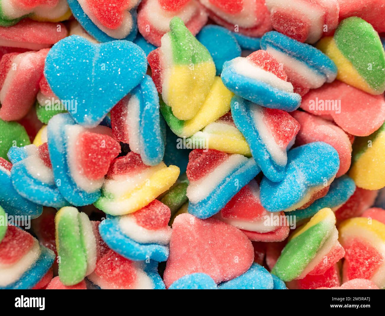 Many colorful jelly beans sweets background. Gumdrops candies with