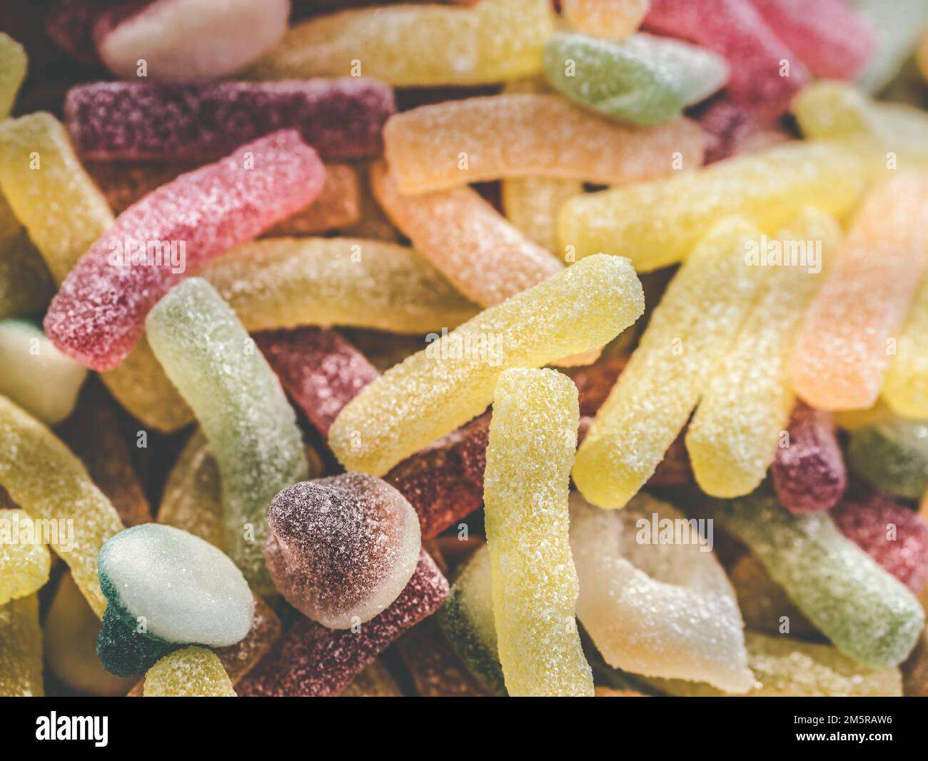 Many colorful jelly beans sweets background. Gumdrops candies with