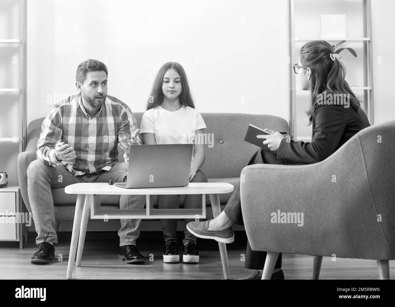father and child at psychologist session. family therapy. parent