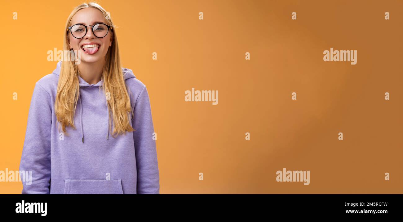 Funny charming female programmer having fun show tongue fool around ...