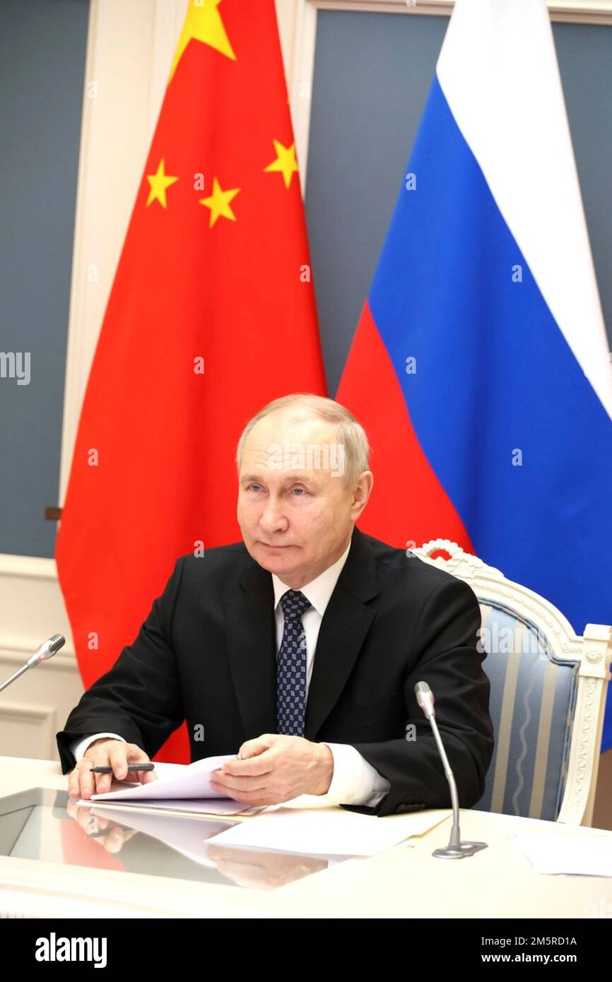 Moscow, Russia. 30th Dec, 2022. Russian President Vladimir Putin takes part in a remote bilateral meeting with Chinese President Xi Jinping via video link from the Kremlin, December 30, 2022 in Moscow, Russia. Credit: Mikhail Klimentyev/Kremlin Pool/Alamy Live News Stock Photo