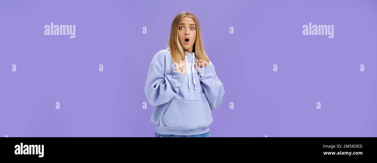 Woman scared of sudden loud noise in dark gasping looking shocked and