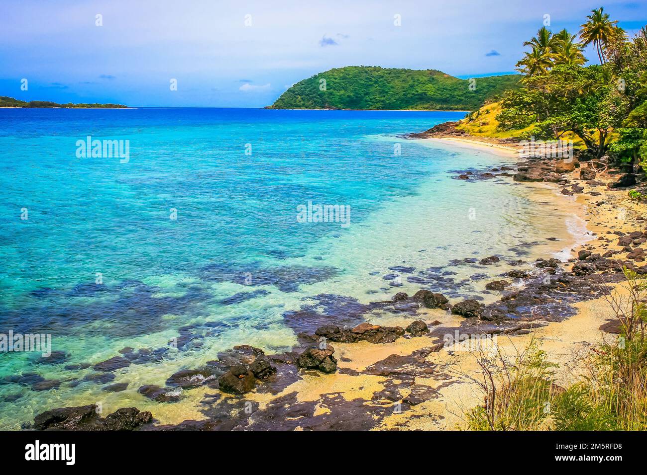 Tropical sandy beach at summer day in Fiji Islands, Pacific ocean Stock Photo