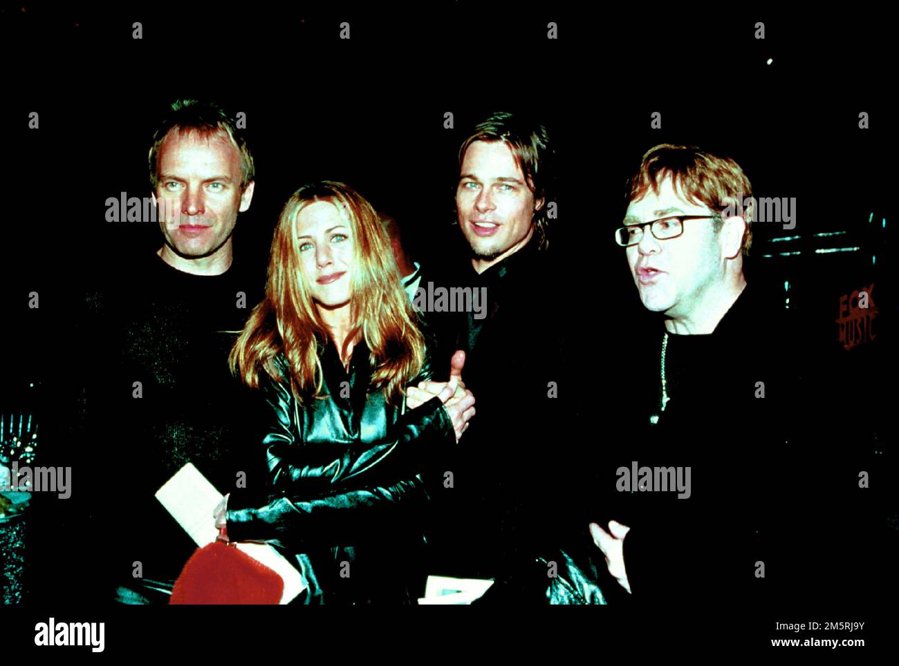 Sting, Jennifer Aniston, Brad Pitt  & Elton John attending MusiCares in 2000 Credit: Ron Wolfson / MediaPunch Stock Photo