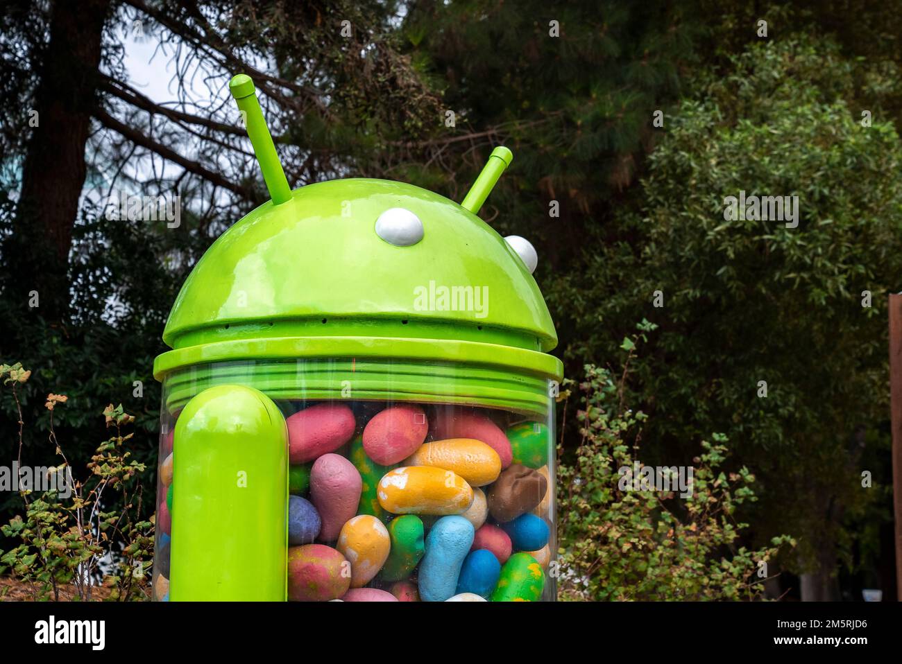 Android jelly bean statue with trees in background in garden at google campus Stock Photo