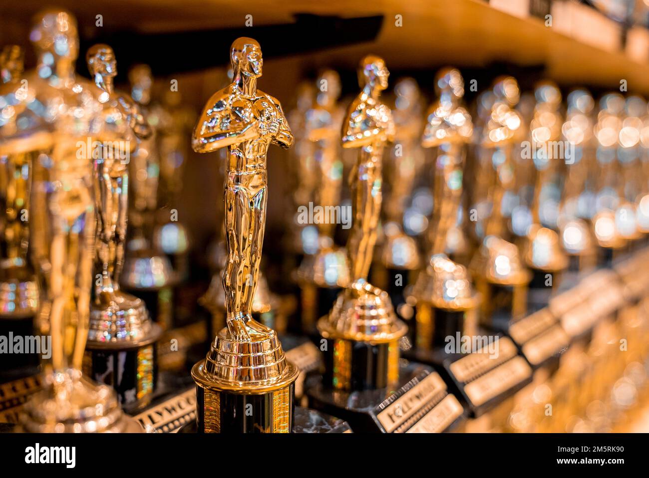 Hollywood golden oscar academy trophies arranged on shelf for sale in shop Stock Photo