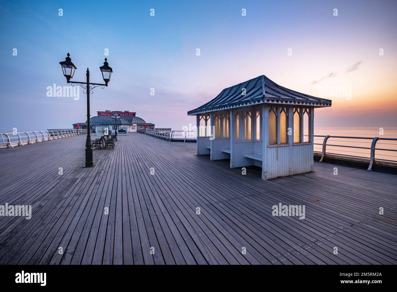 A delicate sunrise over Cromer pier on the north Norfolk coast Stock Photo