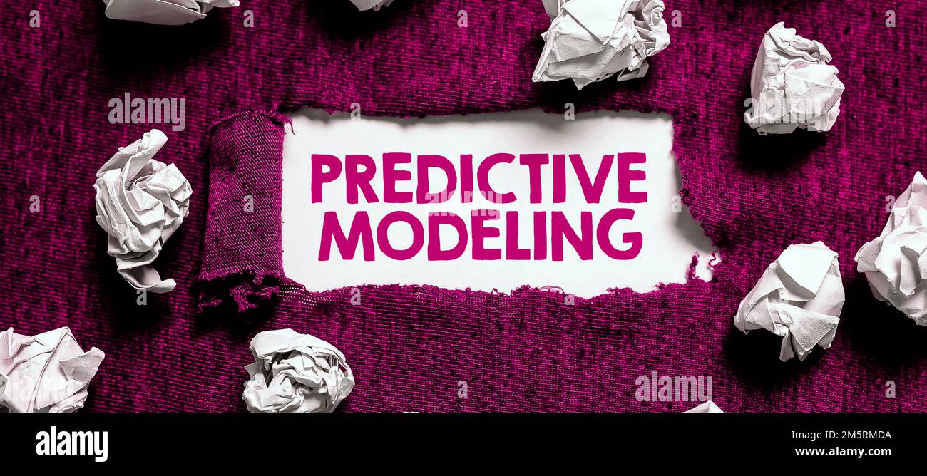 Handwriting text Predictive Modeling. Word for maintenance strategy driven by predictive analytics Stock Photo