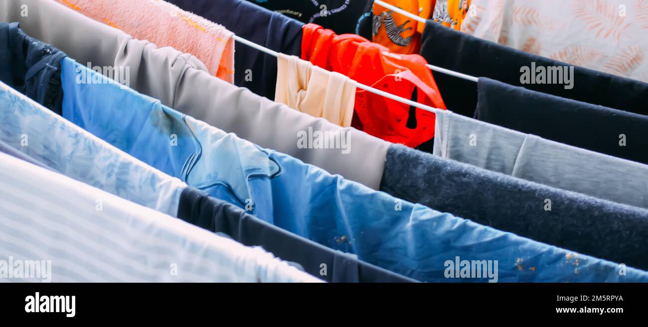 Clean clothes hanging on dryer outdoors Stock Photo Alamy