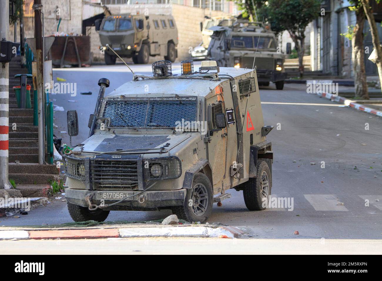 Nablus, Palestine. 30th Dec, 2022. Israeli armoured vehicle take position during a raid in the