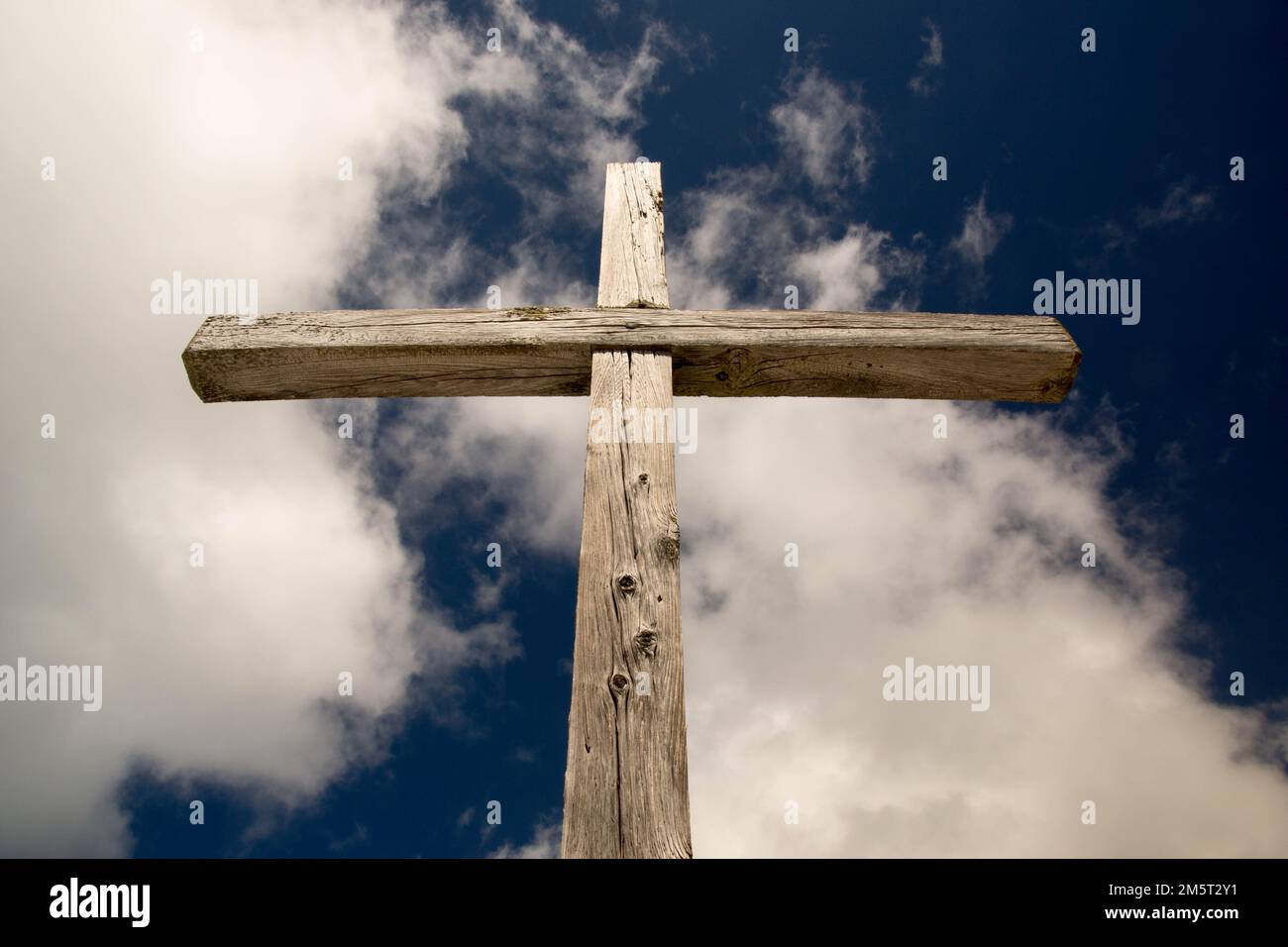 A low angle shot of a wooden cross under the clouds Stock Photo - Alamy