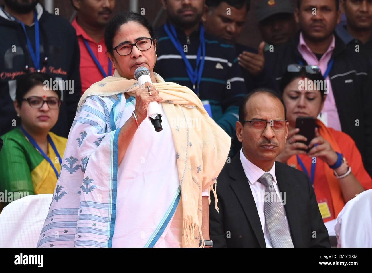 KOLKATA, INDIA - DECEMBER 30: Chief minister Mamata Banerjee refuse to take seat on dias due to Jai Shree Ram slogans and seats alone beside dias during flags off of Vande Bharat Express Train from Howrah to NJP at Howrah station on December 30, 2022 in Kolkata, India. Soon after performing the last rites of his mother Heeraben in Ahmedabad, Prime Minister Narendra Modi attended pre-planned developmental works including flagging off Vande Bharat Express connecting Howrah to New Jalpaiguri, in West Bengal, via video conferencing. This is West Bengal's first and the country's seventh Vande Bhara Stock Photo