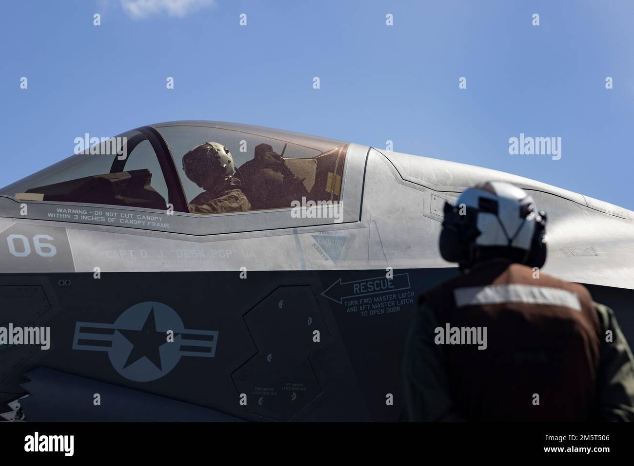 PACIFIC OCEAN (Dec. 2, 2022) - U.S. Marine Corps Capt. Jacob Rea, an F-35B Lightning II pilot assigned to Marine Fighter Attack Squadron (VMFA) 122, 13th Marine Expeditionary Unit, checks the link between the ordnance and the aircraft, Dec. 2. A force in readiness, 13th MEU aviation ordnance technicians arm our aircraft to allow pilots to rapidly respond to threats in all domain environments through naval power projection. The 13th Marine Expeditionary Unit is embarked on the Makin Island Amphibious Ready Group, comprised of amphibious assault ship USS Makin Island (LHD 8) and amphibious trans Stock Photo