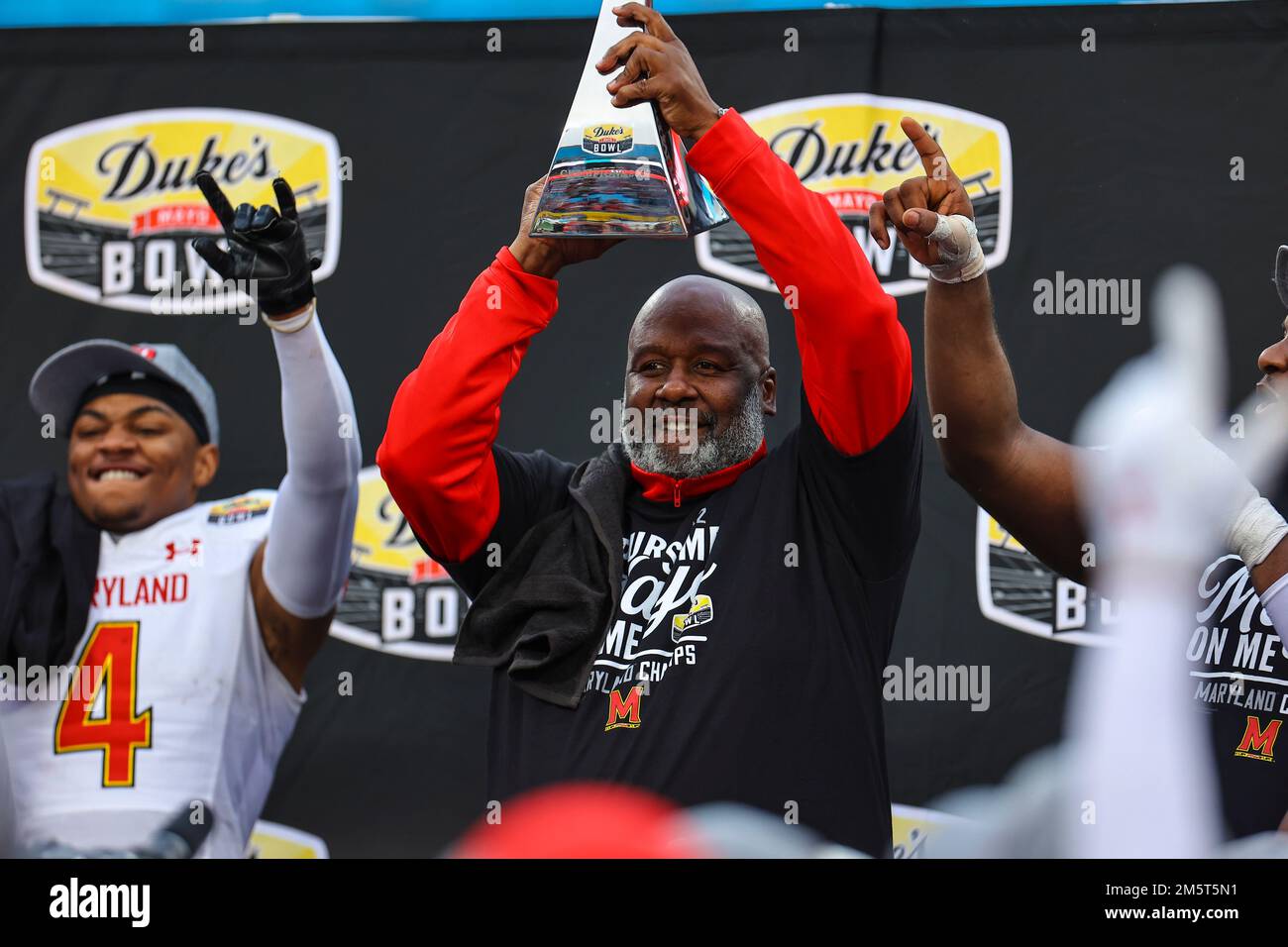 December 30, 2022: Mike Locksley is the head football coach of the  University of Maryland holds up trophy from Mayo Bowl. NCAA football game  between University of Maryland and NC State, Duke