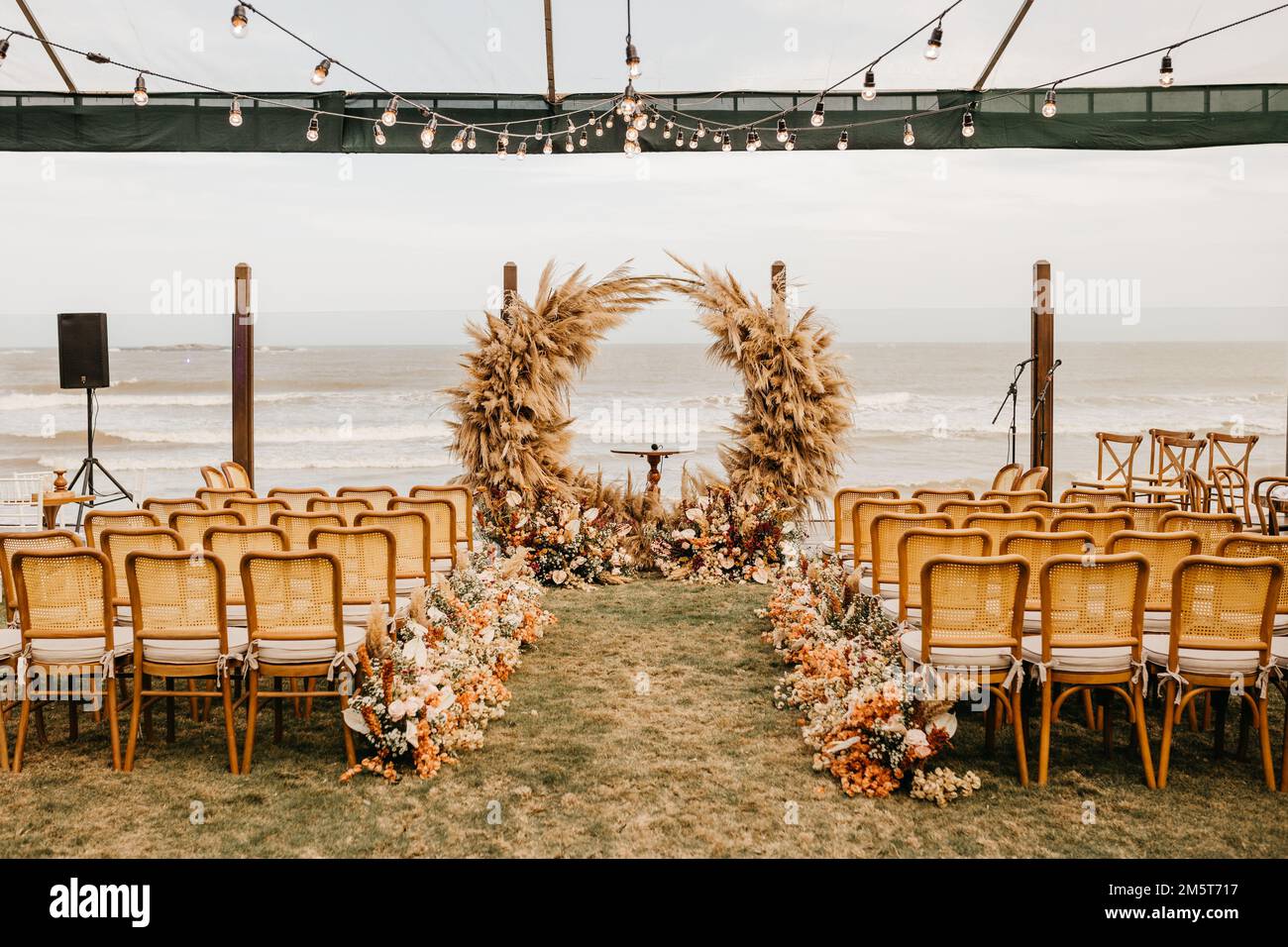 A view of wooden chairs and decorations on a wedding day at outdoor ...