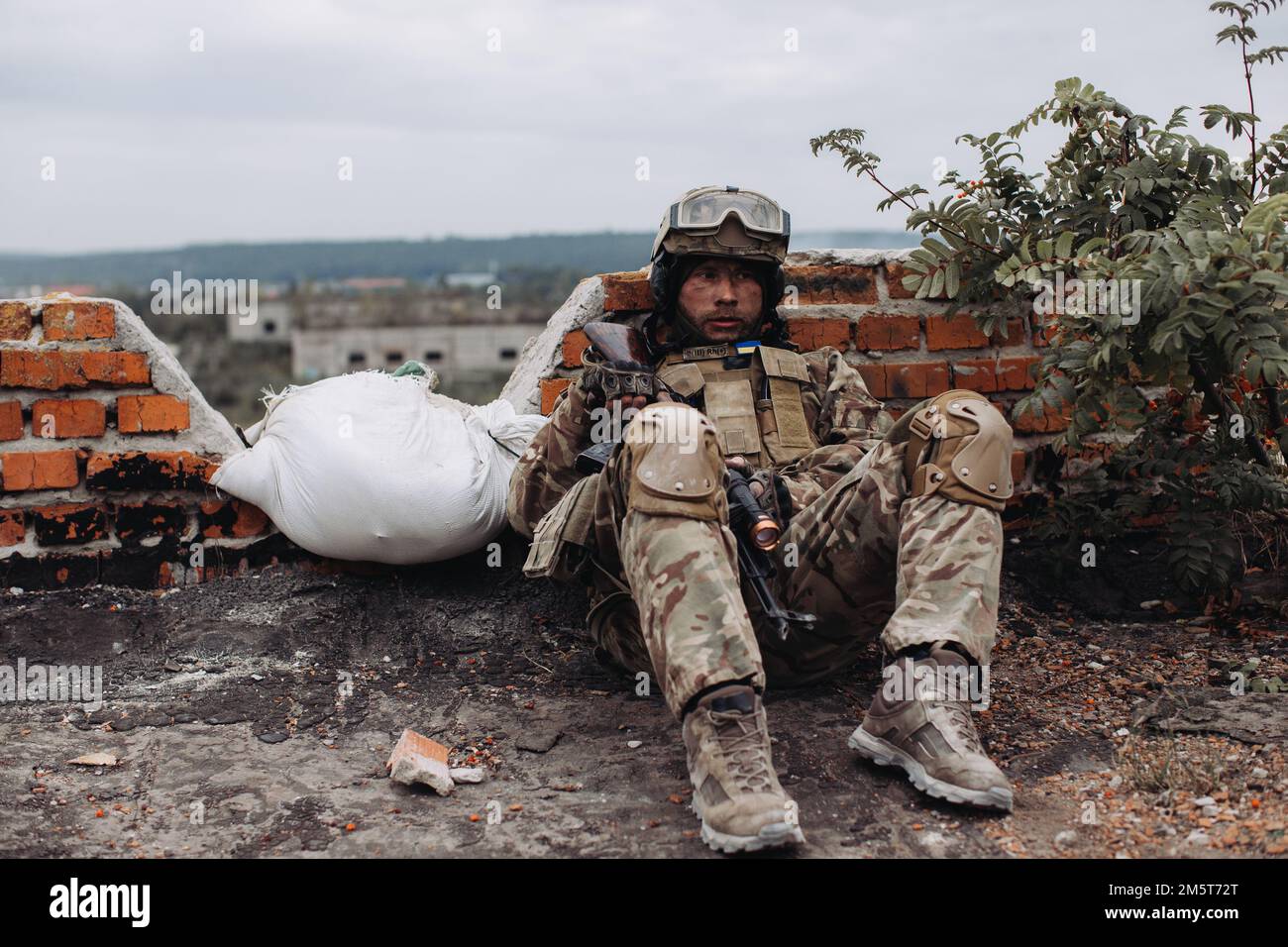 Portrait of a Ukrainian soldier in his combat position. War between Ukraine and Russia. Stock Photo