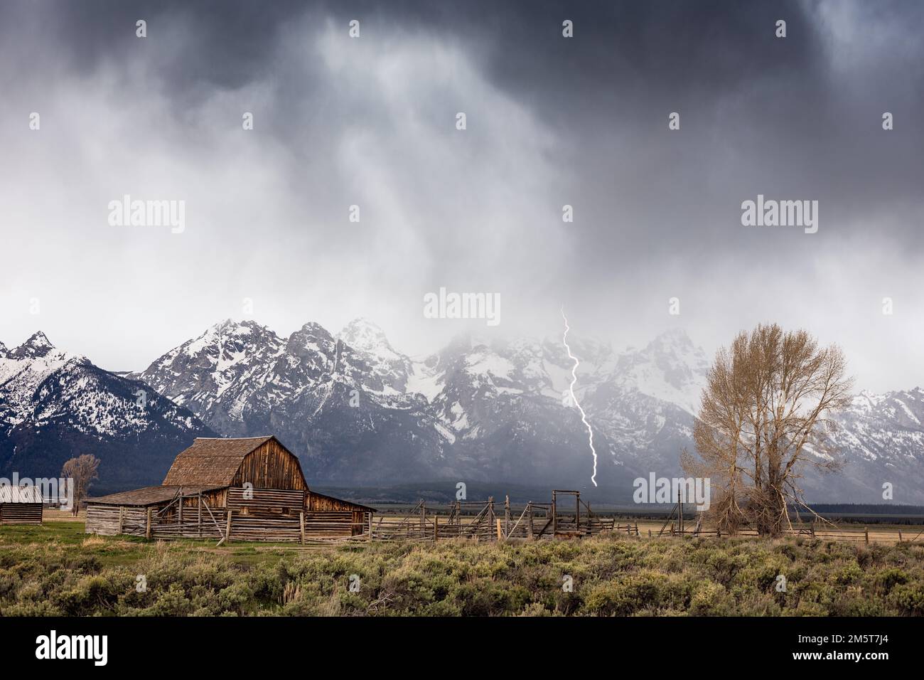 Lightning storm over Moulton Barn on Mormon Row in Grand Teton National Park, Wyoming Stock Photo