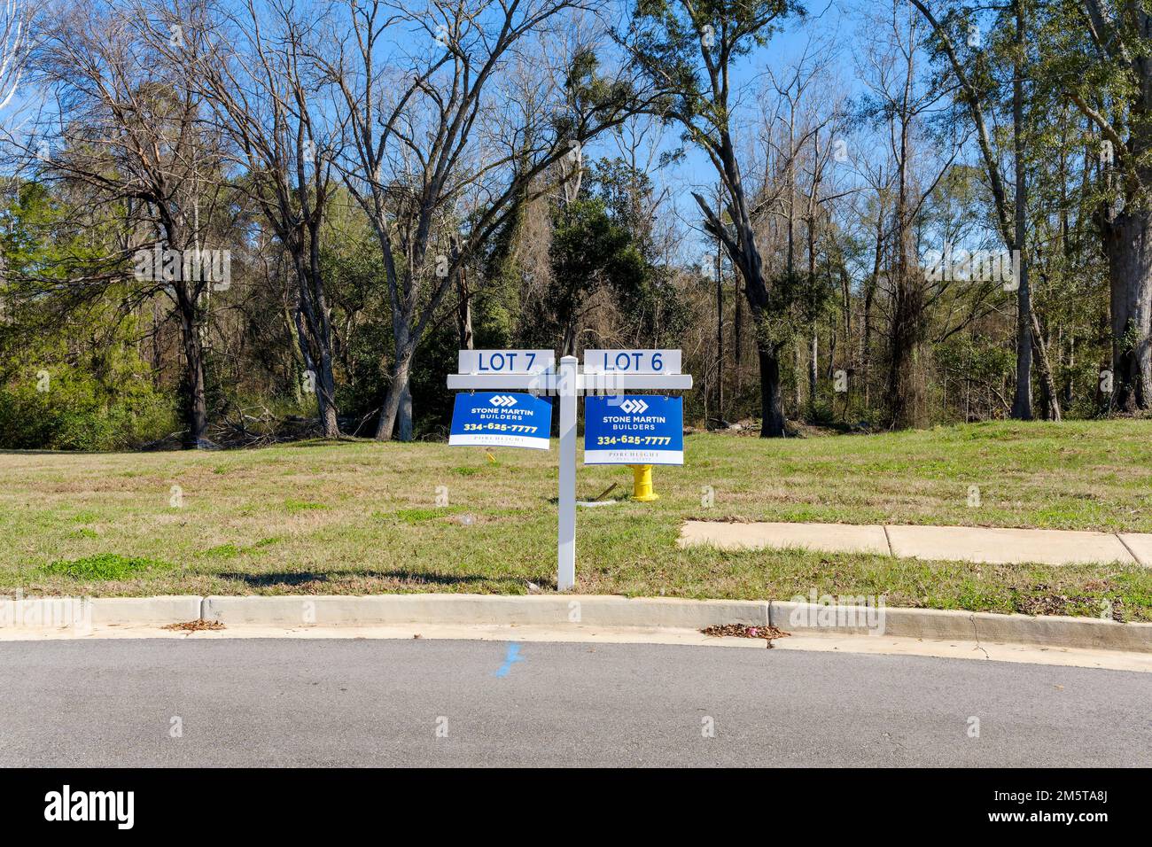 Unoccupied unsold new home building lots for sale indicating a housing slowdown slump or possibly a housing recession in Montgomery Alabama, USA. Stock Photo