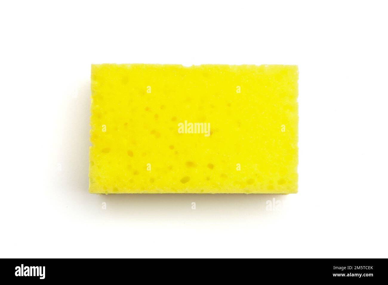 Single yellow kitchen sponge isolated on white background, closeup top