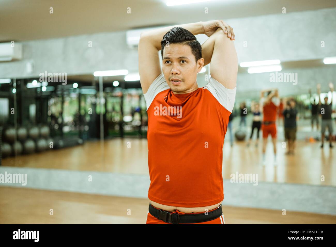 Active person stretching body muscles hi-res stock photography and ...