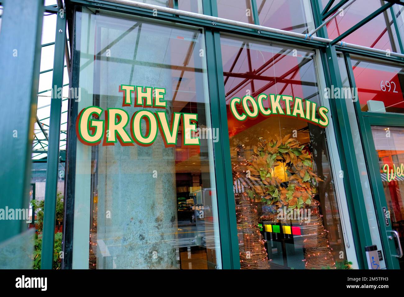 The Grove restaurant sign on its front window in the Yerba Buena neighborhood near San Francisco, California's downtown, SOMA, and Union Square. Stock Photo