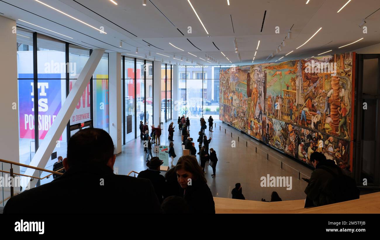 Roberts Family Gallery on the first floor of the San Francisco Museum of Modern Art; Diego Rivera's Pan American Unity mural on exhibit with visitors. Stock Photo