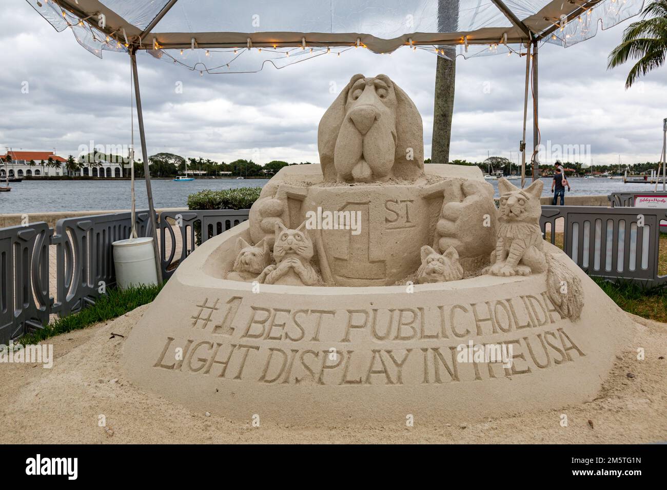 A sand sculpture by Mark Mason and Team Sandtastic celebrates the award for best public holiday light display in the USA in West Palm Beach, Florida. Stock Photo