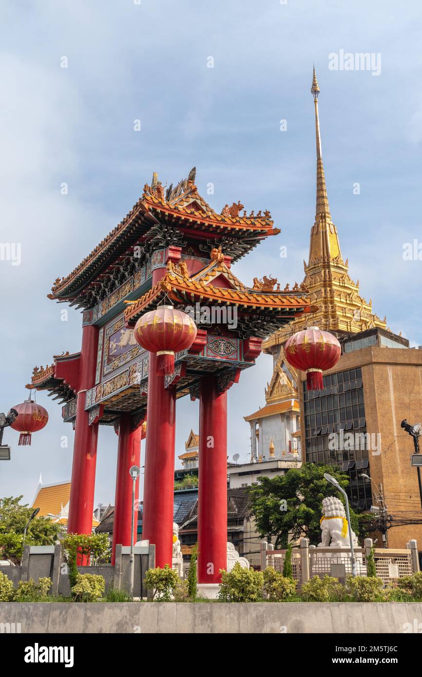 Chinese gate at Odeon Circle and Wat Traimit (Golden Buddha temple) in Chinatown Bangkok, Thailand. Vertical image. Stock Photo