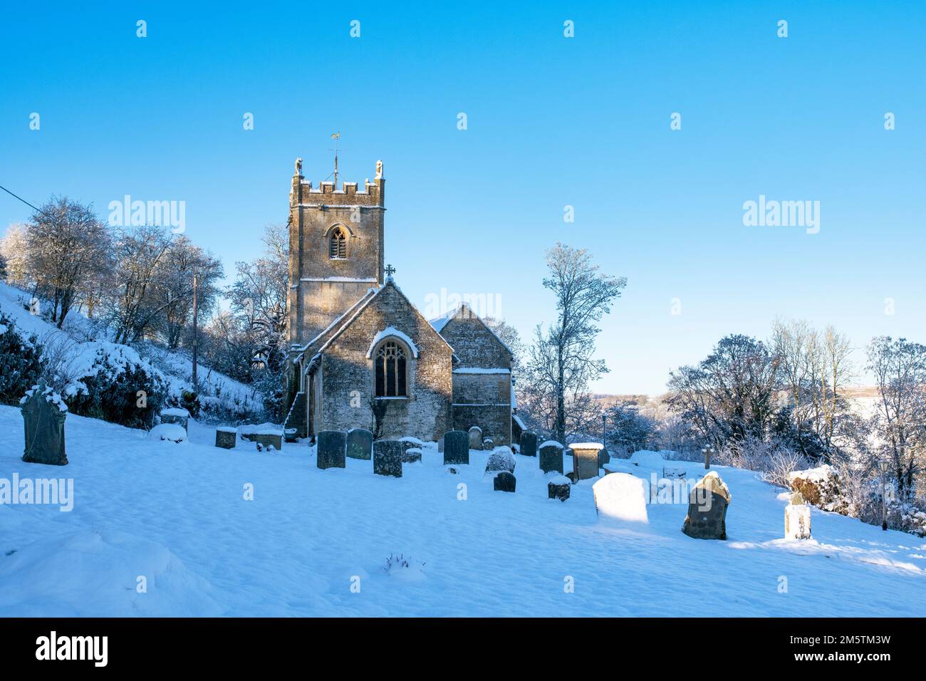 St Oswald's church in the early morning winter snow. Compton Abdale
