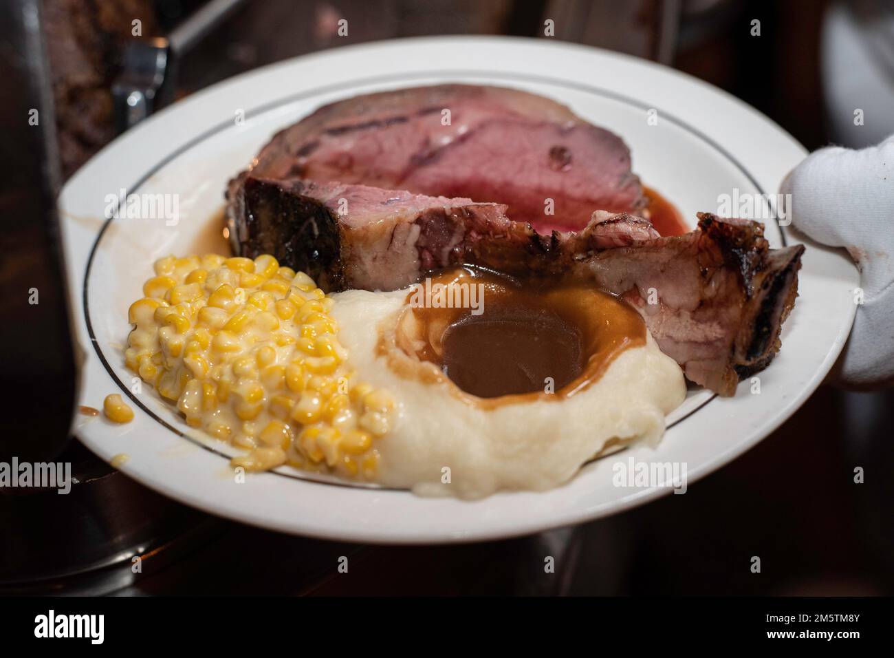 A plate of prime rib during the Utah Utes team dinner at the 2022 Lawry’s Beef Bowl, Thursday, December 29, 2022, at Lawry’s The Prime Rib, in Los Ang Stock Photo