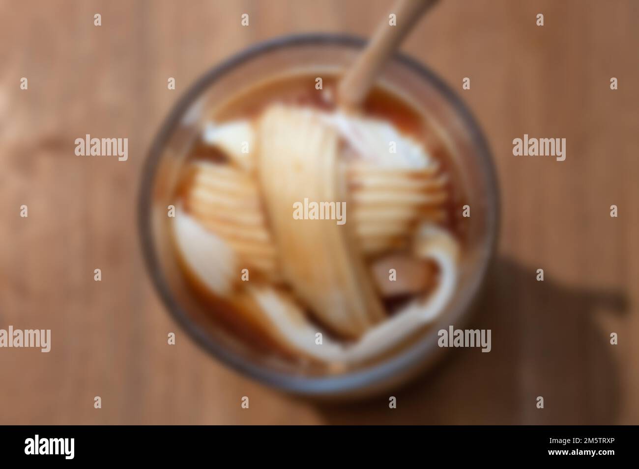 Glass of americano mixed with coconut blur background, stock photo Stock Photo