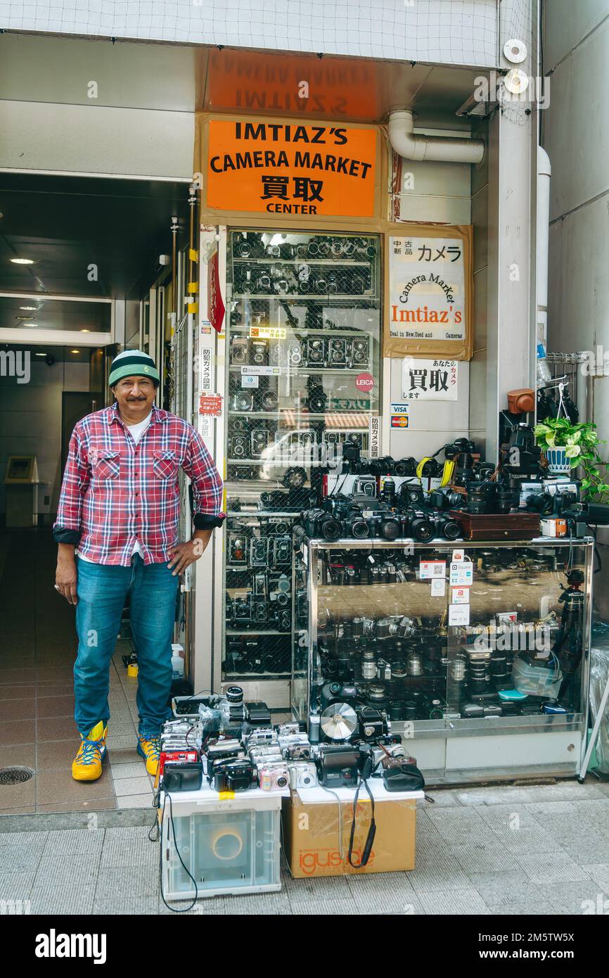 Rows of used vintage film cameras lined the shelves in a camera shop in
