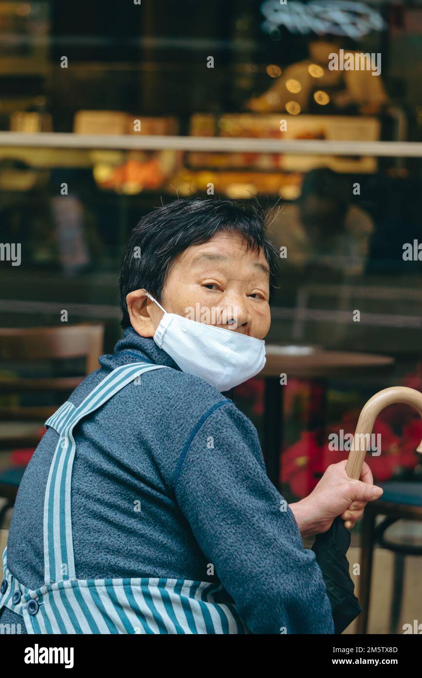 An old lady wearing a mask in public Stock Photo Alamy