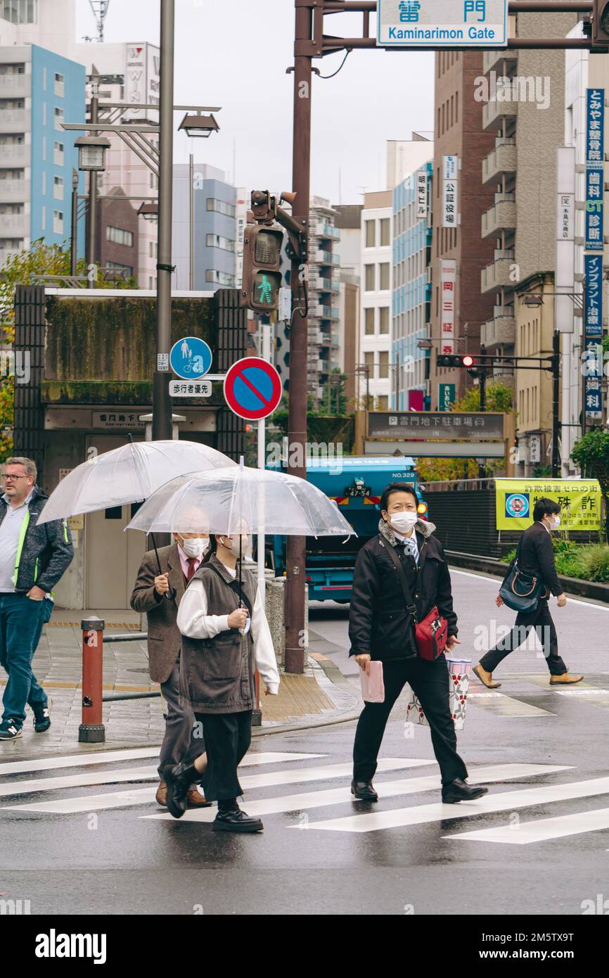 People on the streets of Asakusa during a rainy day Stock Photo