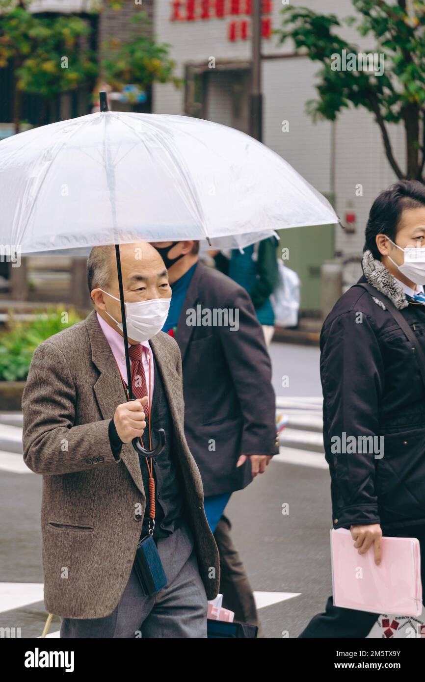 People on the streets of Asakusa during a rainy day Stock Photo