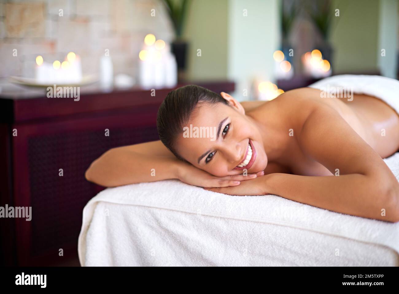 You are now entering a stress free zone. an attractive woman enjoying a day at a health spa. Stock Photo