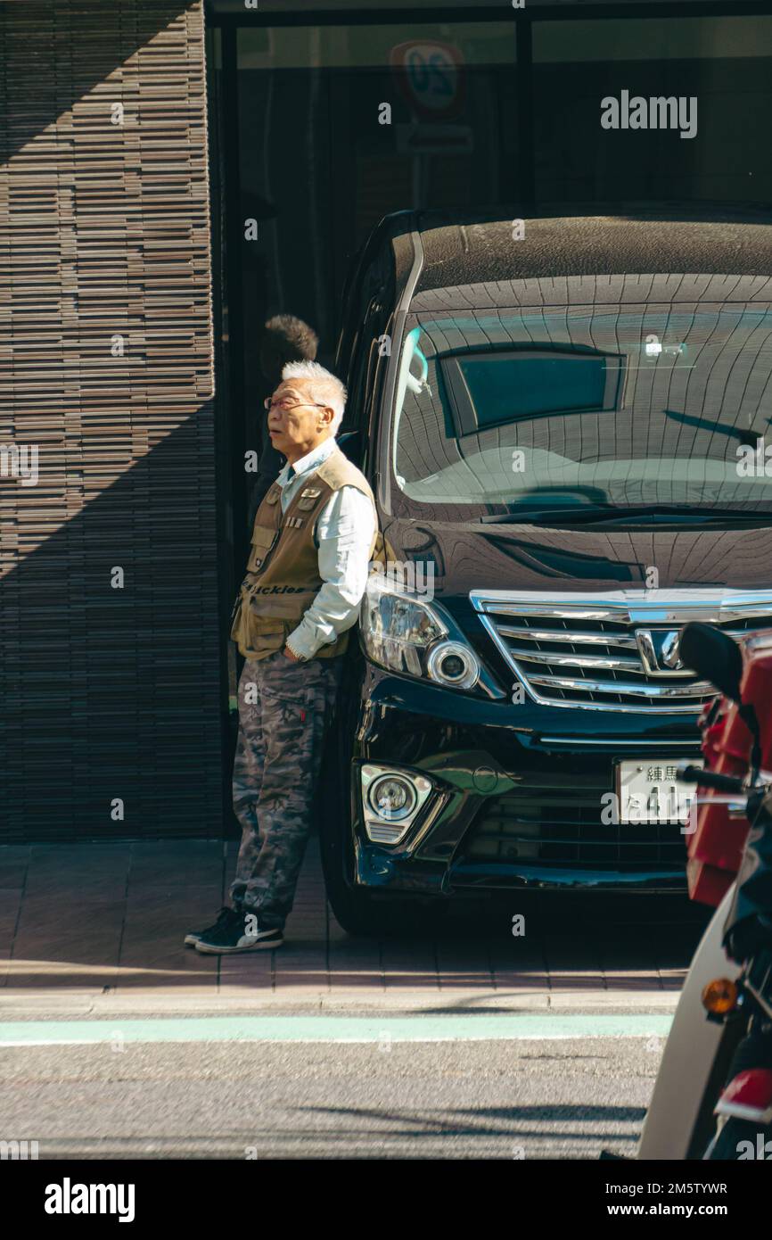 Ageing driver having a break by the streets Stock Photo