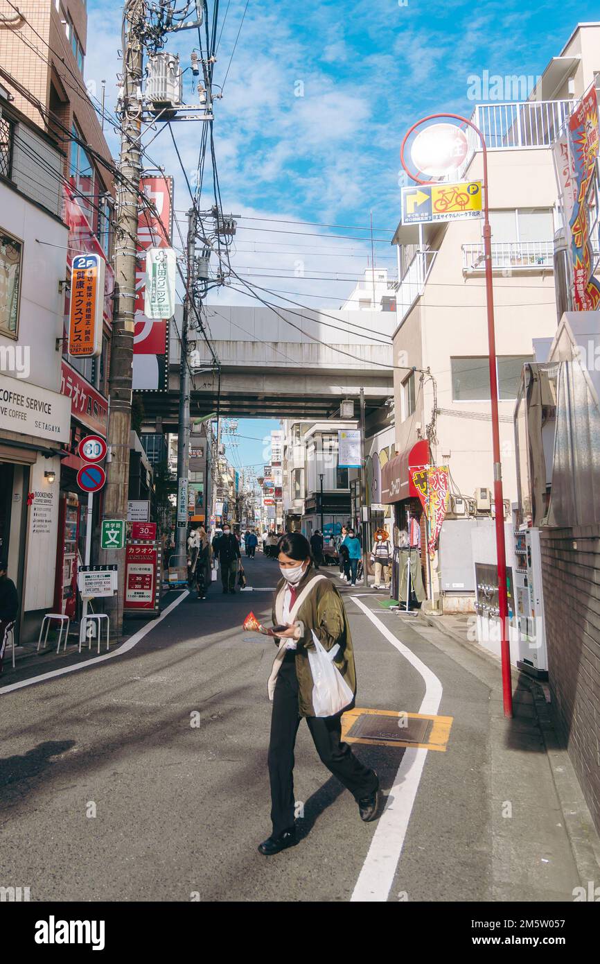 People walking along the streets of Shimokitazawa Stock Photo