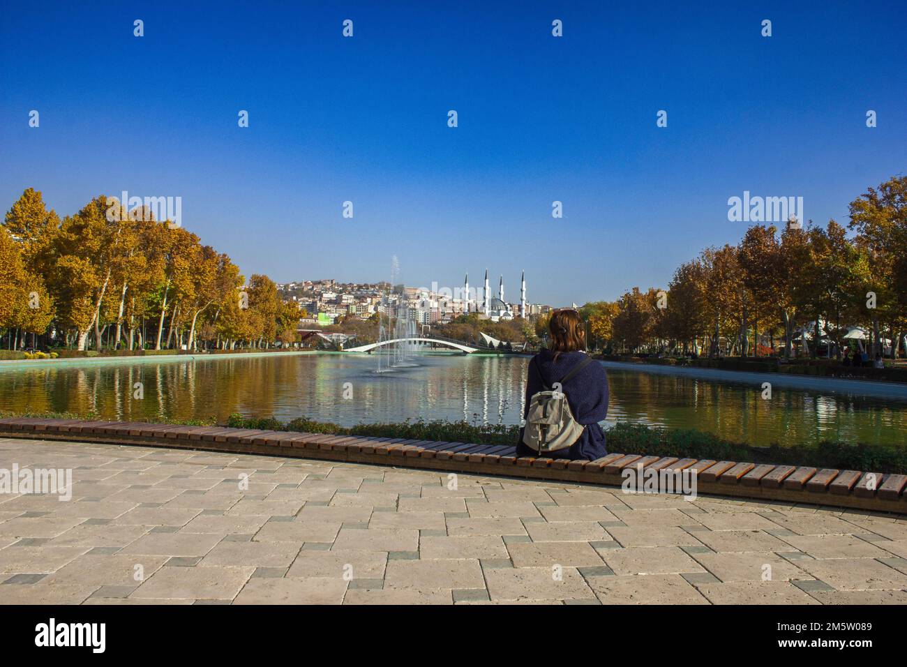 lonely woman sitting against the view Stock Photo