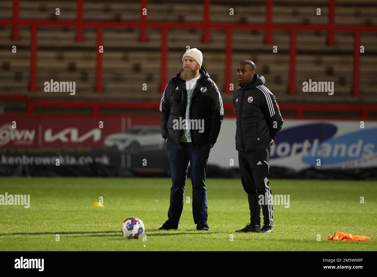 Crawley Town Co Owner Preston Johnson ( L) and interim manager Darren Byfield  watch the warm-up before the EFL League Two match between Stevenage v Crawley Town at the Lamex Stadium. 30th Dec 2022 Stock Photo