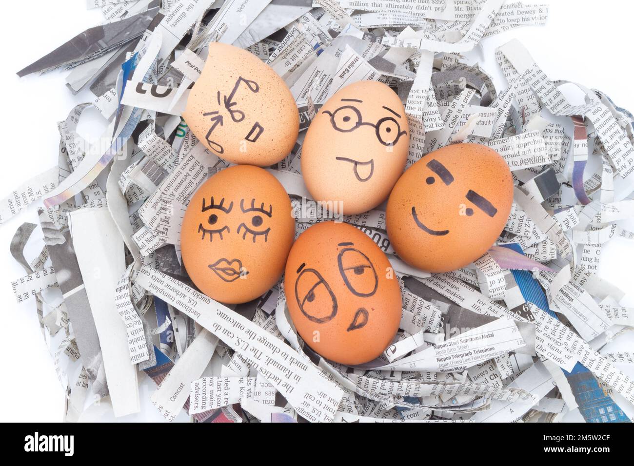 egg face on newspapers recycle Stock Photo Alamy