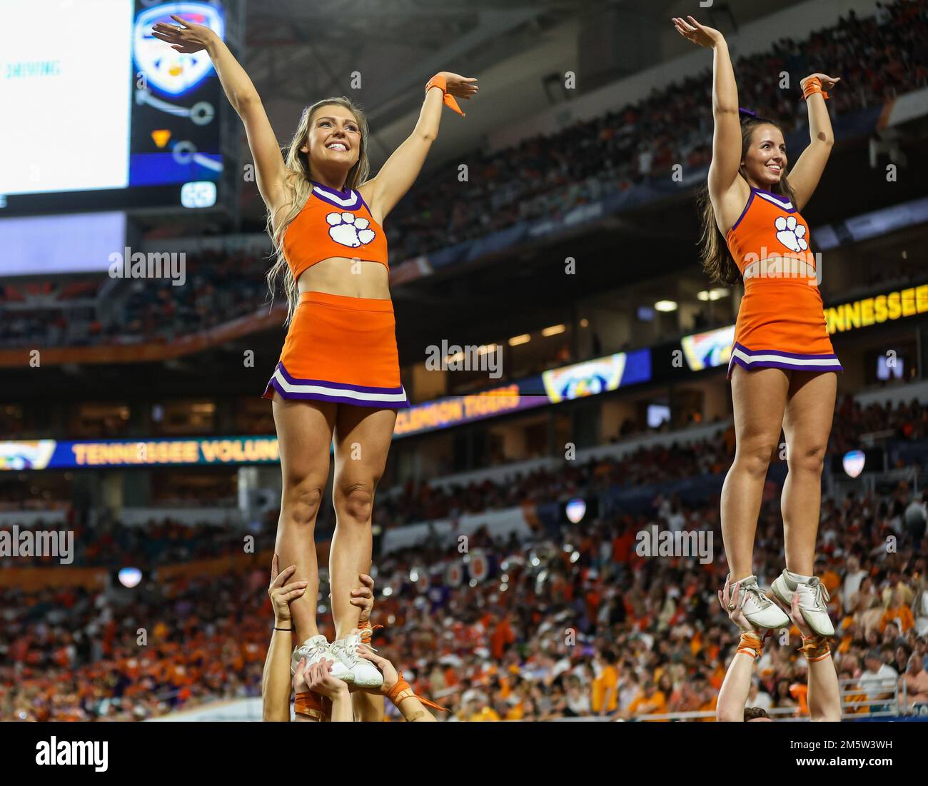 Miami Gardens, FL, USA. 30th Dec, 2022. Clemson cheerleaders entertain the fans during the 2022 Capital One Orange Bowl football game between the Clemson Tigers and Tennessee Volunteers at Hard Rock Stadium in Miami Gardens, FL. Kyle Okita/CSM/Alamy Live News Stock Photo