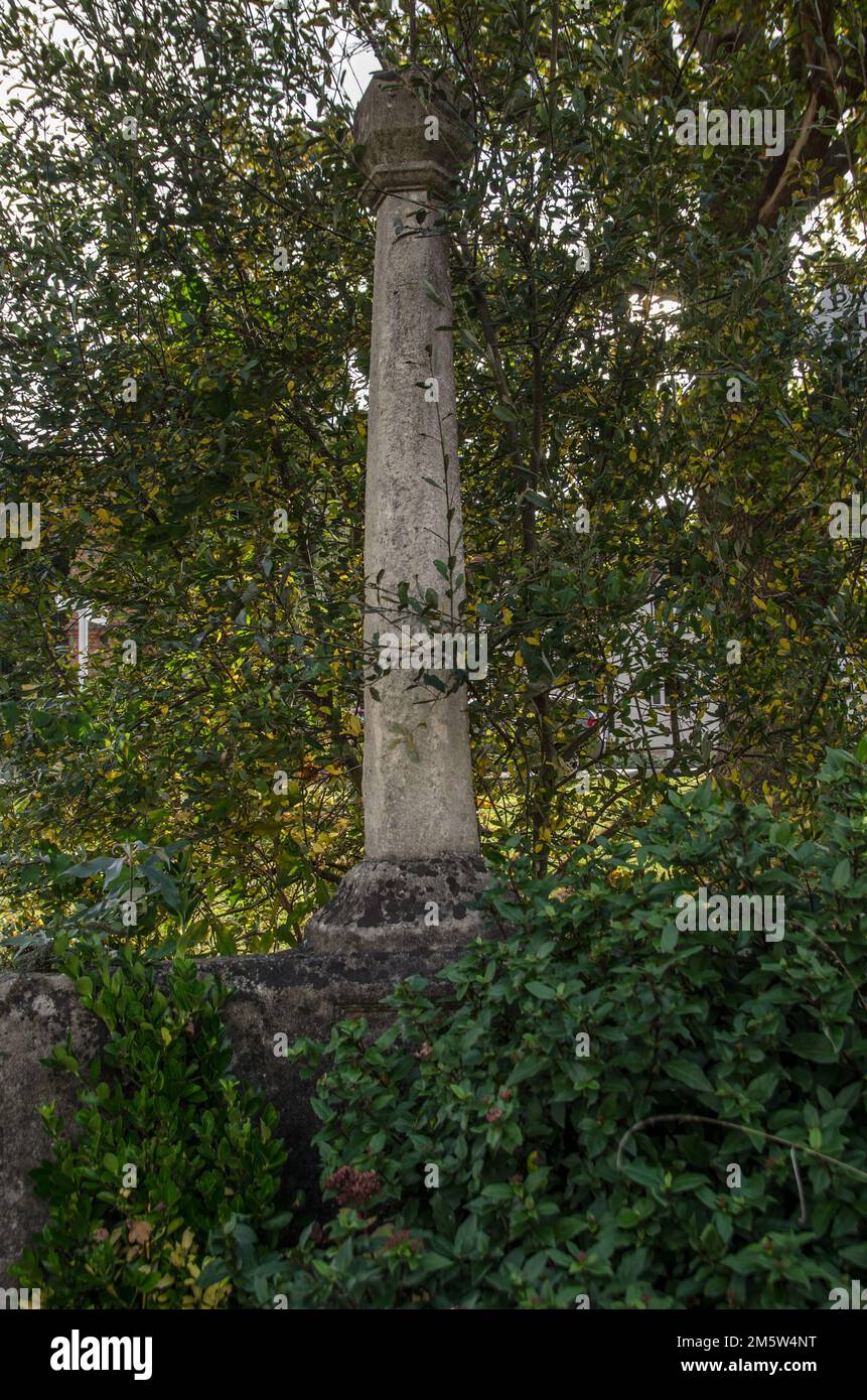 View through the undergrowth of the monumental water fountain erected as a monument to Queen Victoria's Diamond Jubilee in the village of Aldermaston, Stock Photo