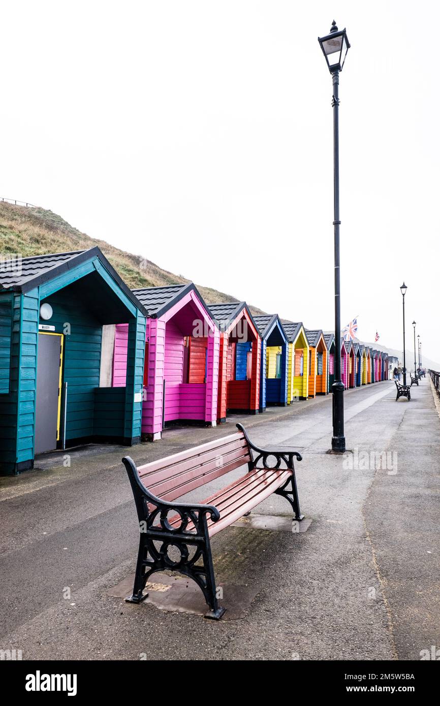 Colourful wooden beach huts at the North Yorkshire seaside town of
