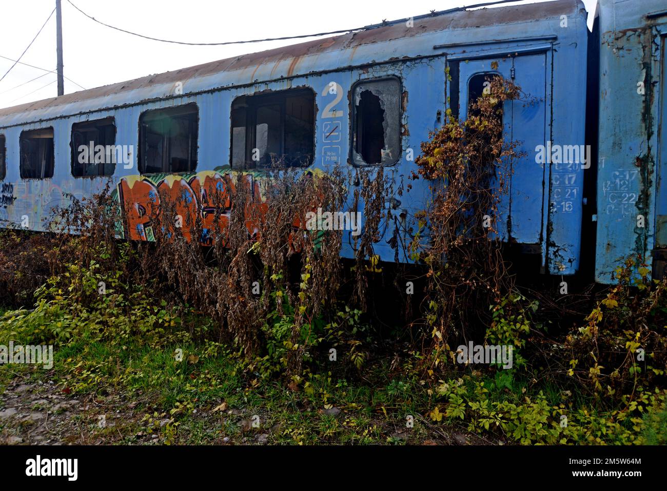 Redundandt and disused railway carriages vandalised and covered in graffiti, Bucharest, Romania Stock Photo
