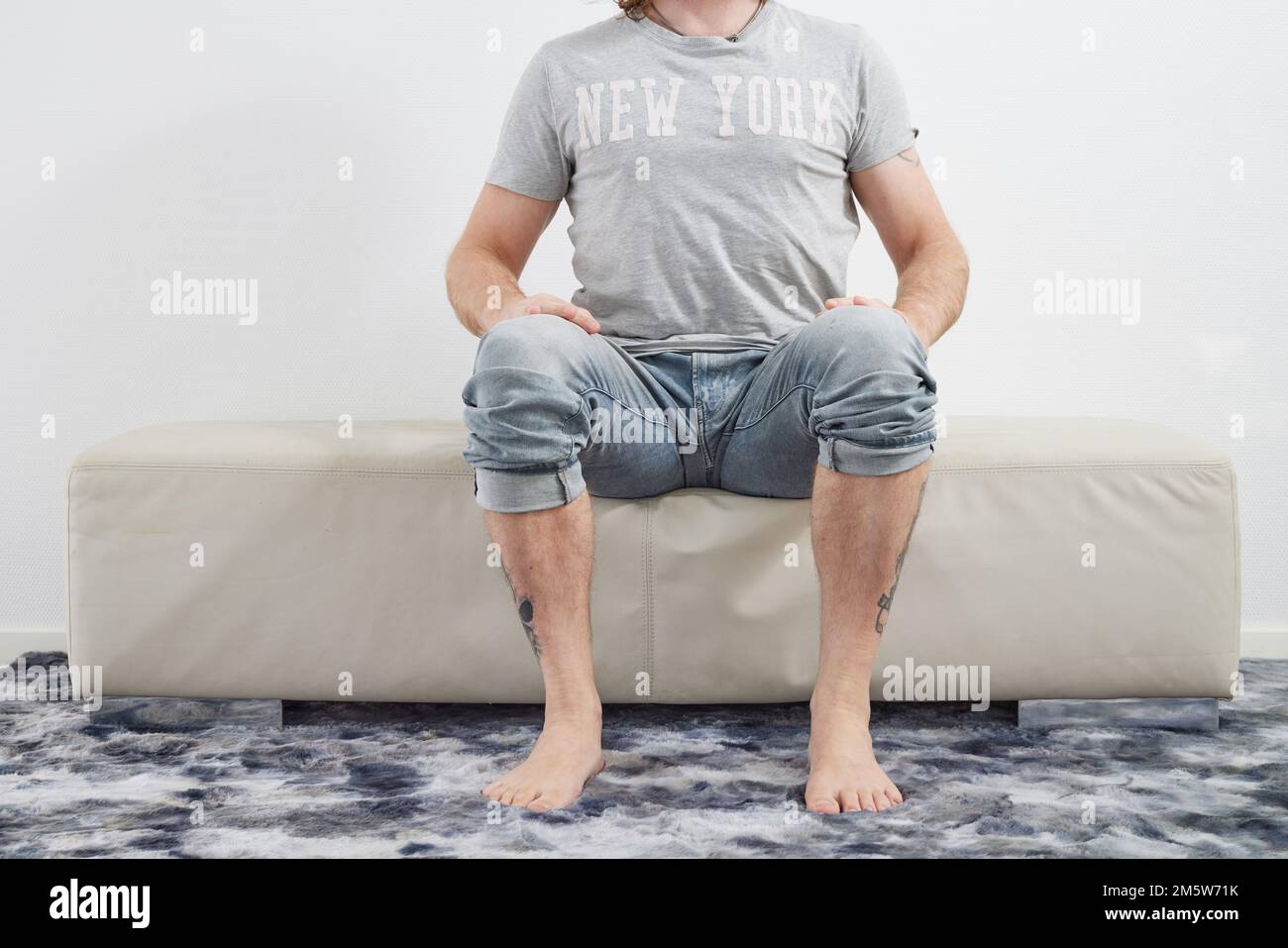 Man sitting barefoot hi-res stock photography and images - Alamy