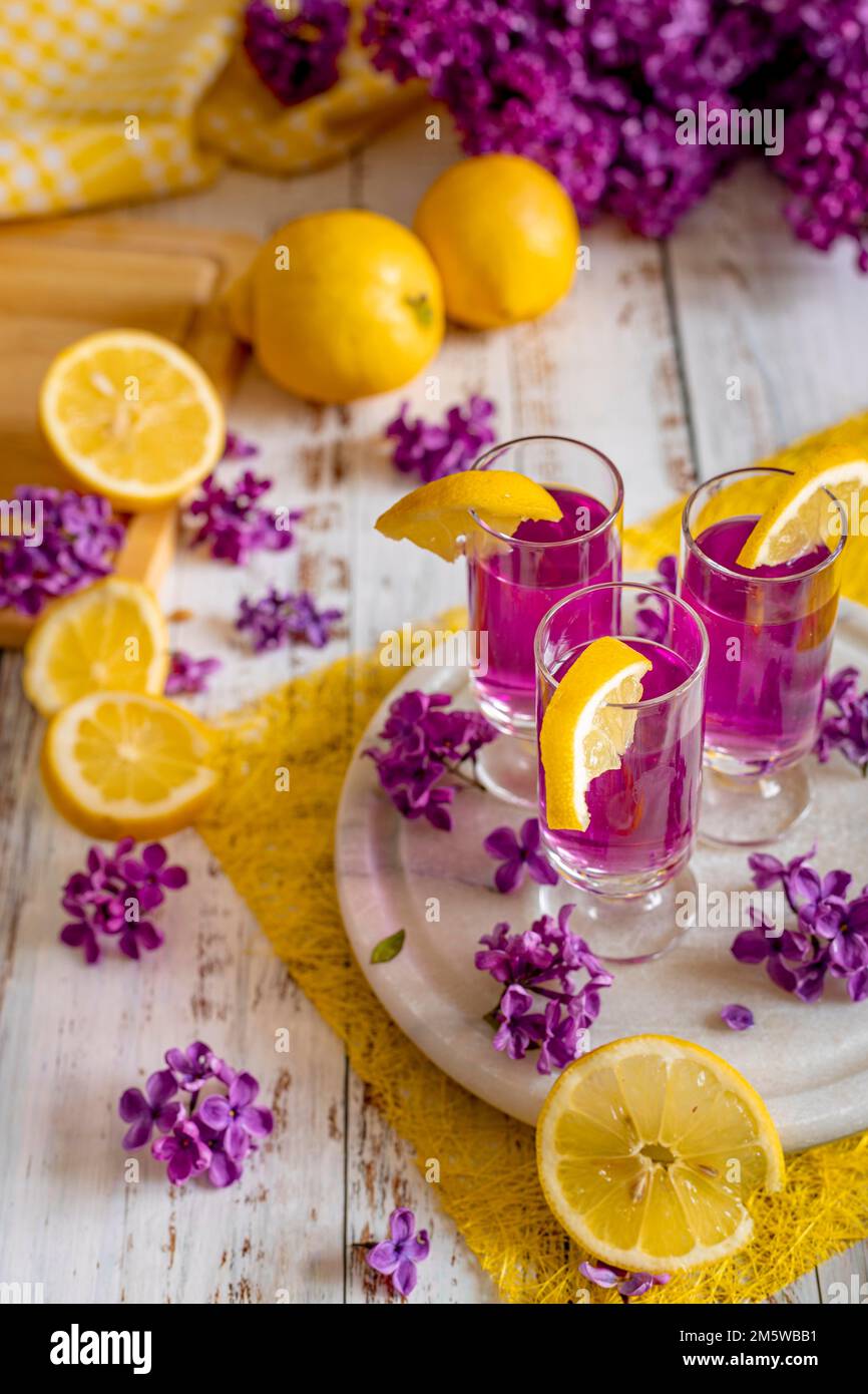 Purple and yellow, Decorative, Liqueur and cocktails with lemons Stock Photo