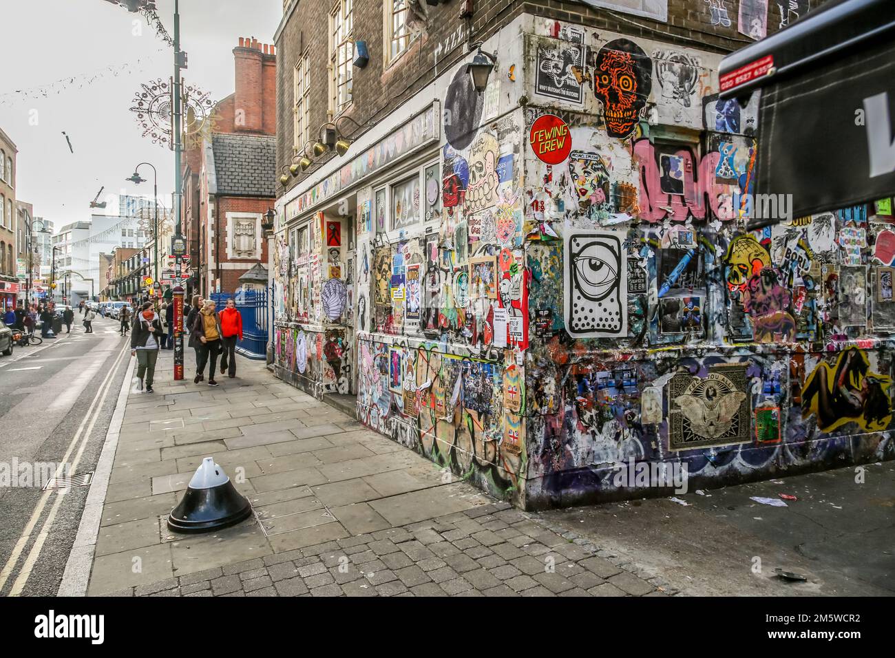 Colourful collection of street art on the disused Seven Stars Public House on Brick Lane in London's Shoreditch, 2022. Stock Photo