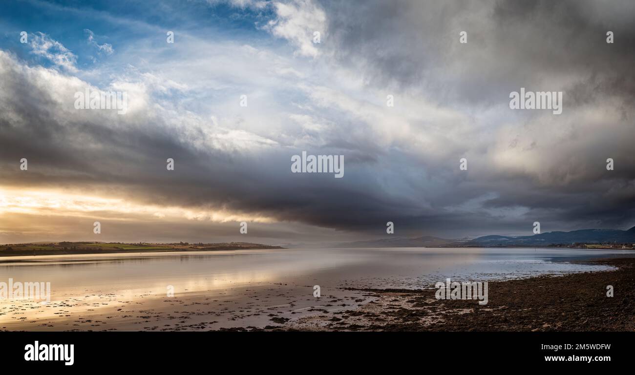 Looking up the Cromarty Firth from Invergordon as rain sweeps in from the west. Stock Photo